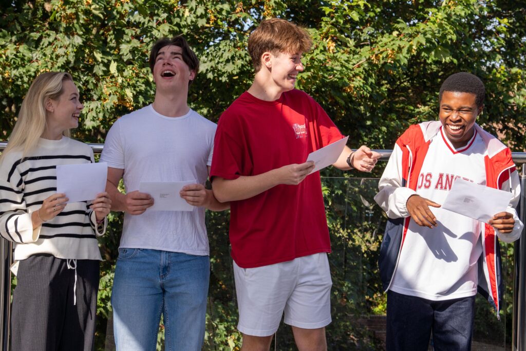 Pupils celebrating a level results