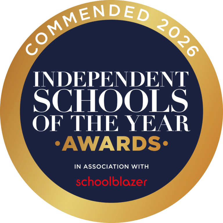 A circular gold and navy badge reads “Commended 2026 Independent Schools of the Year Awards in association with Schoolblazer” in bold white and gold text on a dark blue background.
